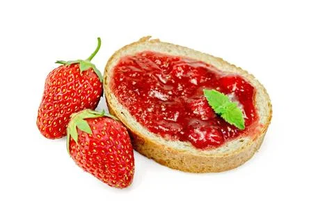 Bread with strawberry jam and berries Slice of french bread with strawberr... Stock Photos