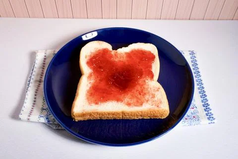 Bread with strawberry jam Stock Photos