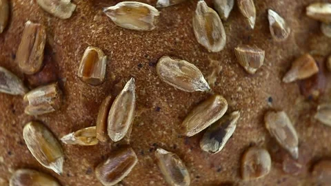 Bread with sunflower seeds, rotates counterclockwise, turning, top view 動画素材 148878140