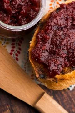 Bread with sweet cherry jam Stock Photos
