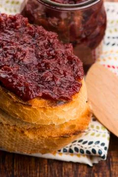 Bread with sweet cherry jam Stock Photos