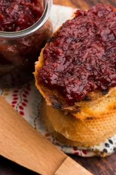 Bread with sweet cherry jam Stock Photos
