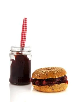 Bread with sweet jam Bread bun with sweet jam isolated over white backgrou... Stock Photos