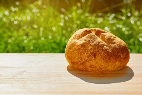 Bread is on the table against the green Stock Photos