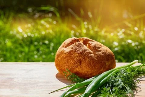 Bread is on the table against the green Stock Photos