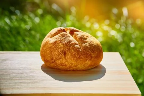 Bread is on the table against the green Stock Photos