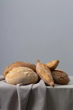 Bread on a table covered with a tablecloth Stock Photos