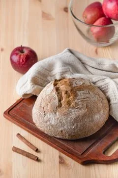 Bread on a table made of wood. Red apples. Country style composition. 스톡 사진