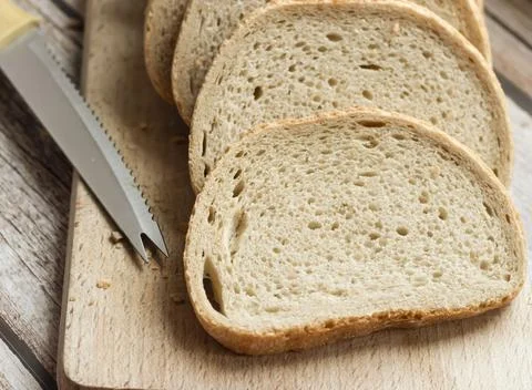 The bread is on the table. Sliced ​​and fresh Stock Photos