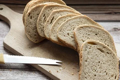 The bread is on the table. Sliced ​​and fresh Fotos Stock
