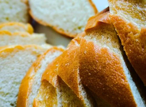 Bread texture, close-up. Freshly baked bread, top view. Food backgrounds. Stock Photos