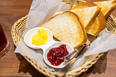 Bread toast with butter and strawberry jam Stock Photos