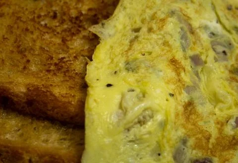 Bread toast with omelette for breakfast. Stock Photos