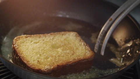 Bread toast is overturned with a crispy crust in slow motion 스톡 동영상 150667666
