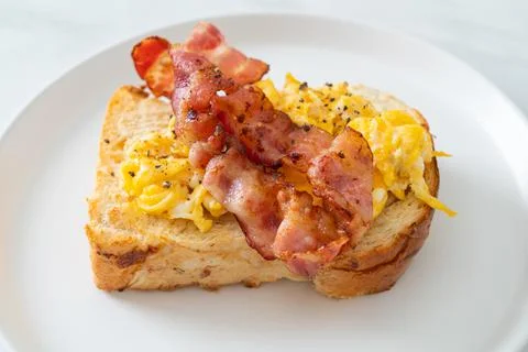 Bread toast with scramble egg and bacon Stock Photos