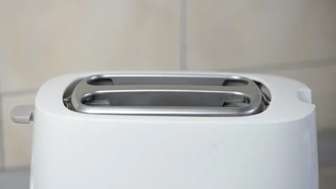 Bread in toaster Stock Footage 155473158