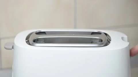 Bread in a toaster Stock Footage 155473212