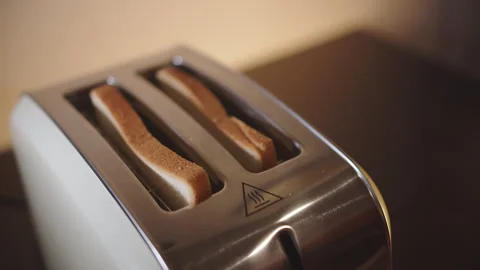 Bread in a toaster jumps out Stock Footage 259551330