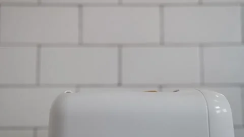 Bread Toasting on a White Toaster Machine Stock Footage 246963042