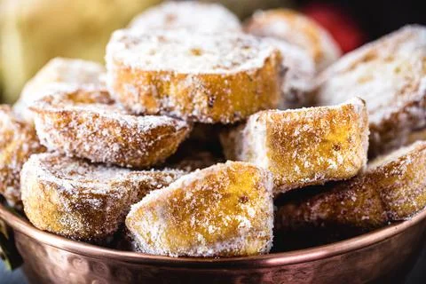 Bread tray with cinnamon and fried sugar, typical Brazilian dessert called ra Stock Photos