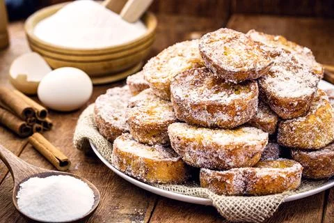 Bread tray with cinnamon and fried sugar, typical Brazilian dessert called ra Stock Photos