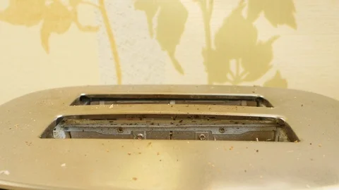 The bread was badly burned in the toaster 스톡 동영상 123963139