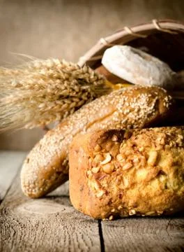 Bread, wheat and basket Stock Photos