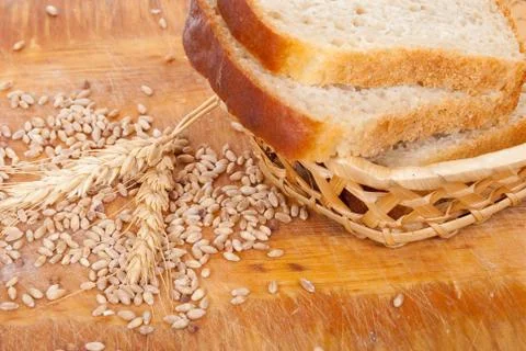 Bread with wheat and ears on plate Stock Photos