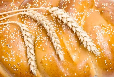 Bread with wheat ears close-up Stock Photos