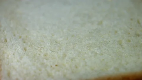 Bread white close-up pores structure, rotating, macro, top view. Stock Footage 168696356