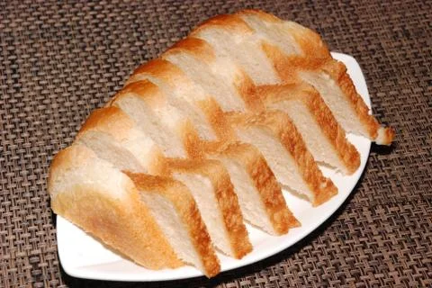 Bread on the white plate Stock Photos