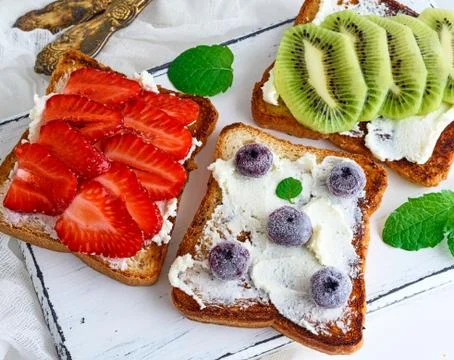 Bread from white wheat smeared with curd Stock Photos