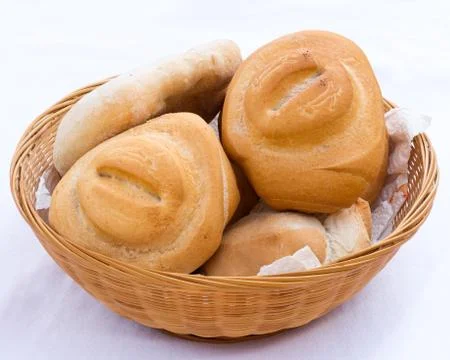 Bread in wicker basket Stock Photos