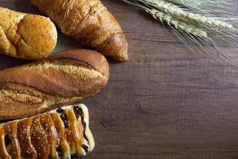 Bread on Wood Background Stock Photos