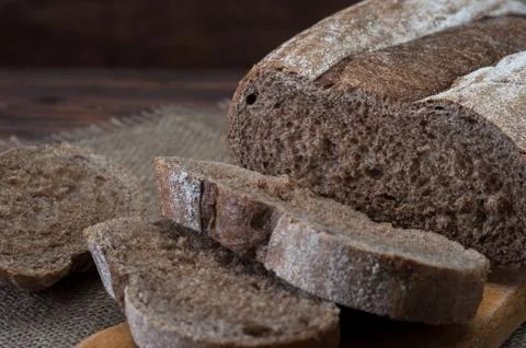 Bread on wooden background Stock Photos