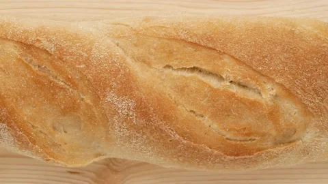 Bread on a wooden board. Video stock 168735222