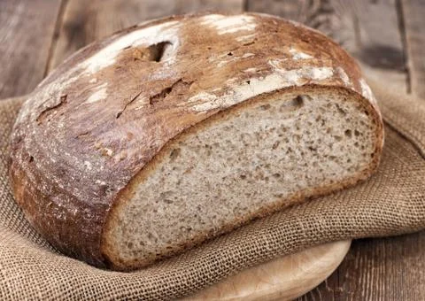 Bread on wooden table. Stock Photos