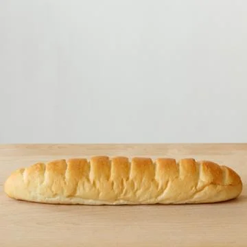 Bread on wooden table with white background Stock Photos