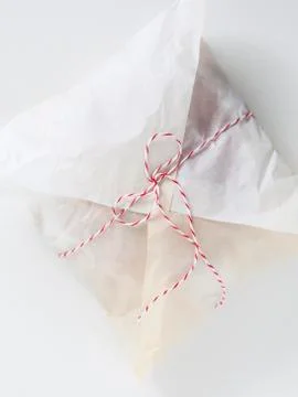 Bread wrapped in paper and tied up with string, view from above Stock Photos