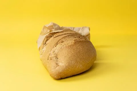 Bread on yellow background. Stock Photos