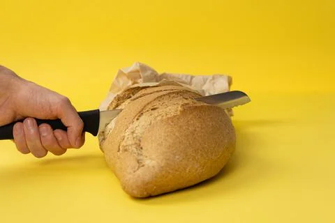 Bread on yellow background. Stock Photos
