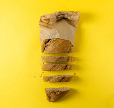Bread on yellow background. Stock Photos