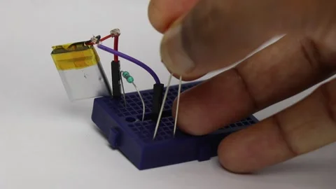 Breadboard circuit with lithium polymer battery and resistor Stock Footage 345885304