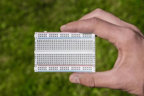 Breadboard in hand. Stock Photos