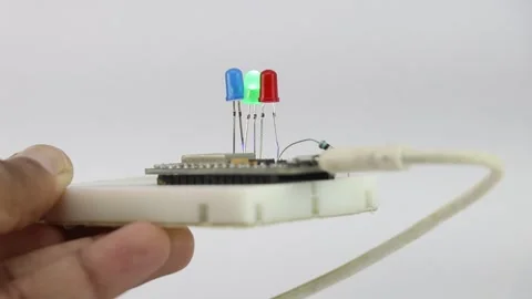 Breadboard with programmable micro controller and multiple colored LED Video stock 252072953