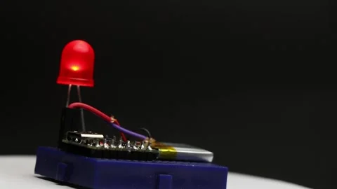 Breadboard with small microcontroller powered by lithium polymer battery Stock Footage 345885303