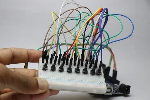 Breadboard with tactile push buttons and microcontroller Stock Photos