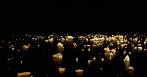 Breadcrumbs on a black table. Dried bread crumbs are used to make a crisp and Stock Footage 147034791