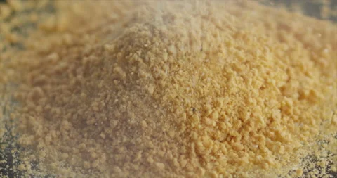 Breadcrumbs fall on a mountain of breadcrumbs Stock Footage 197868543