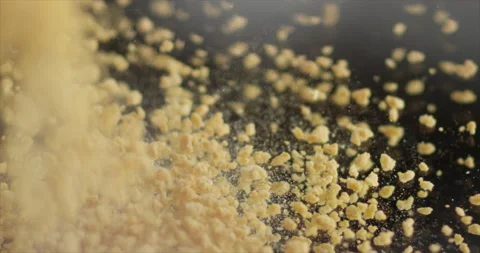 Breadcrumbs falling on a mirror surface Stock Footage 198345124